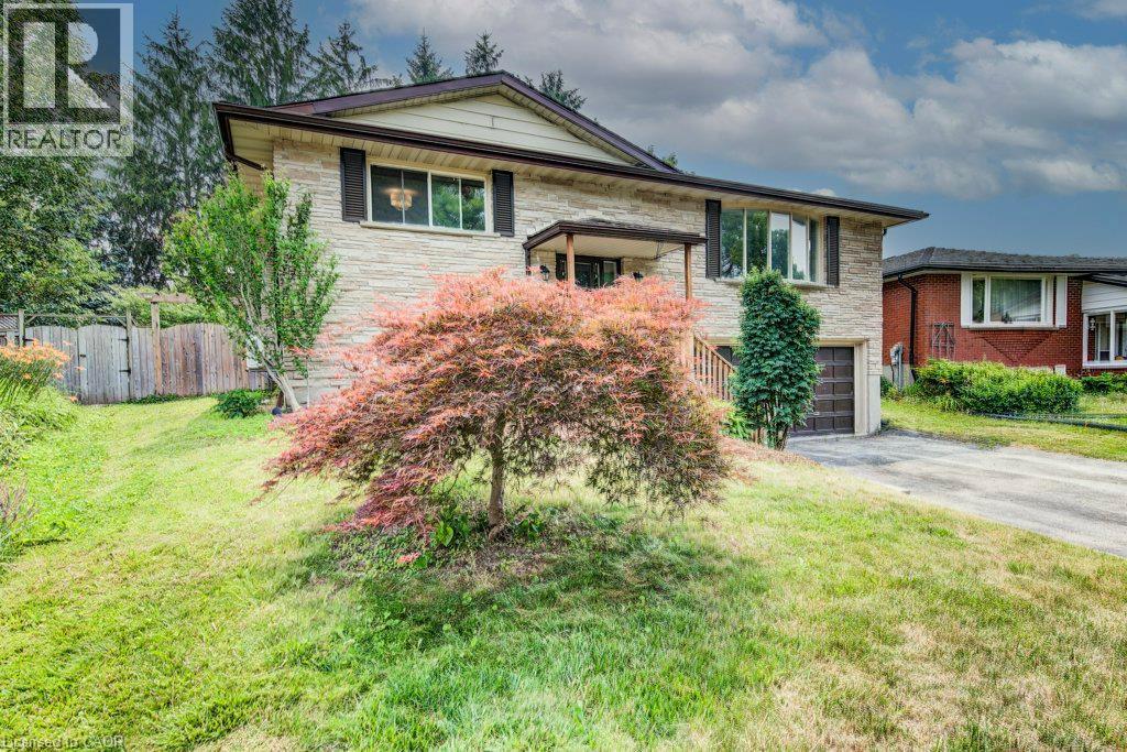 Raised bungalow featuring a light-colored brick facade and contrasting dark shutters - 109 White Oak Place, Waterloo, ON - Outdoor