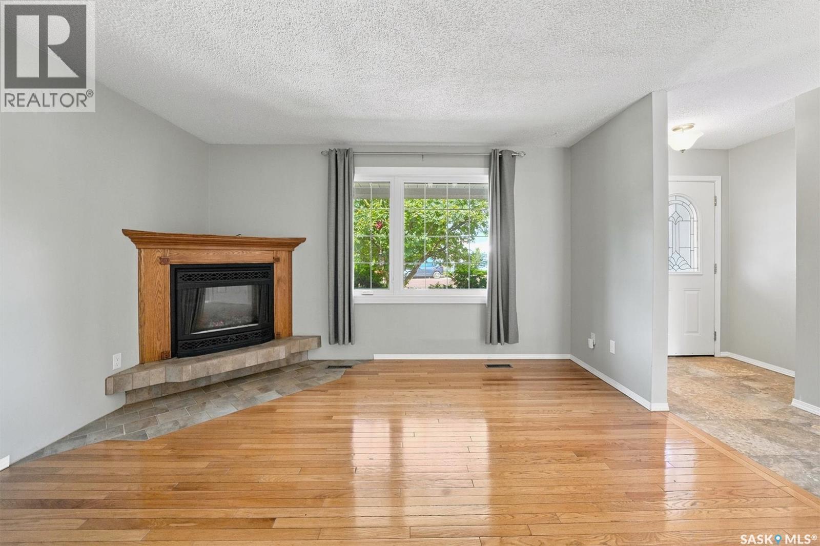 144 Sylvite Crescent, Allan, SK - Indoor Photo Showing Living Room With Fireplace