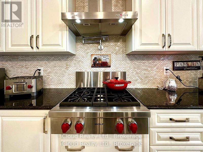 A WOLF gas range, Wall Ovens & pot filler - 56 Esther Crescent, Thorold, ON - Indoor Photo Showing Kitchen With Upgraded Kitchen