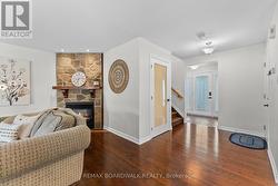 Looking at foyer & gorgeous fireplace in livingrm - 