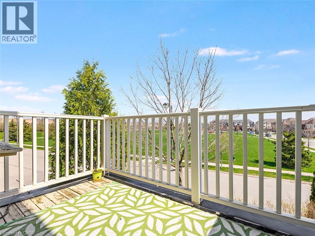 Elevated outdoor space featuring a wood-plank floor and white railing - 656 Frank Place, Milton, ON - Outdoor With Balcony