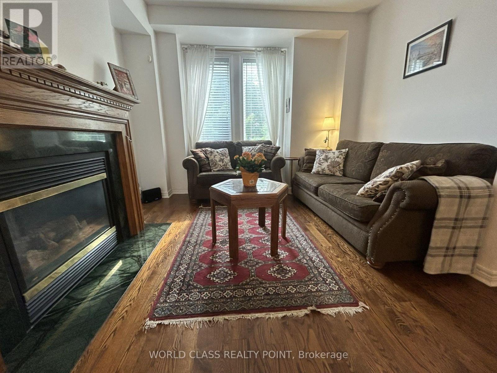 7 Carnation Road, Markham, ON - Indoor Photo Showing Living Room With Fireplace