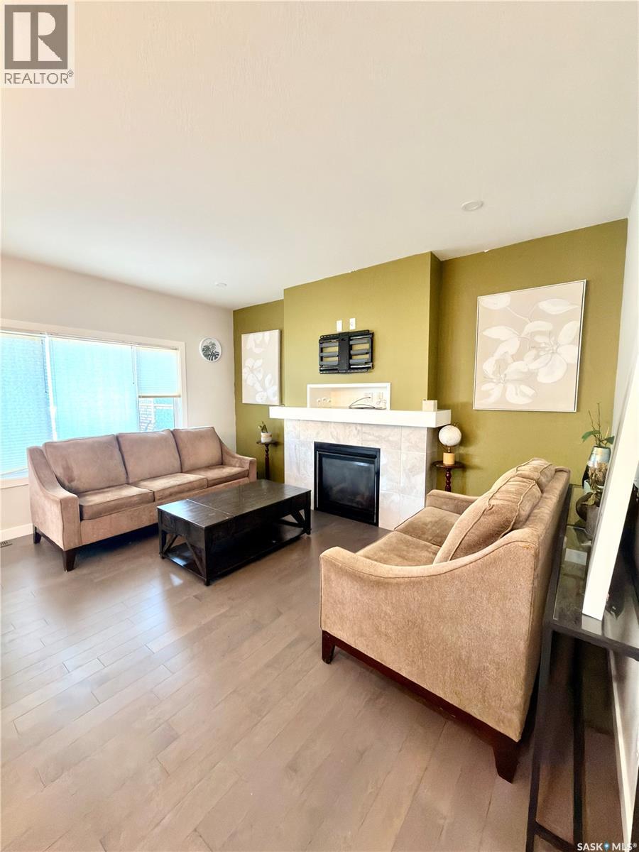 539 Secord Manor, Saskatoon, SK - Indoor Photo Showing Living Room With Fireplace