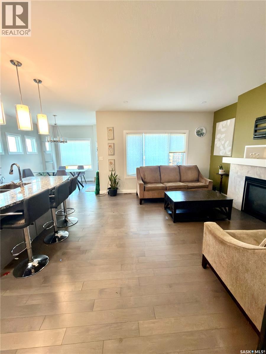 539 Secord Manor, Saskatoon, SK - Indoor Photo Showing Living Room With Fireplace