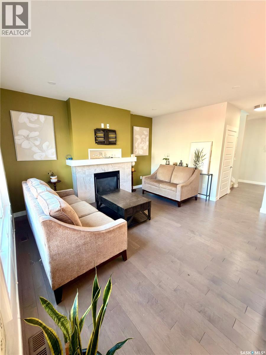 539 Secord Manor, Saskatoon, SK - Indoor Photo Showing Living Room With Fireplace