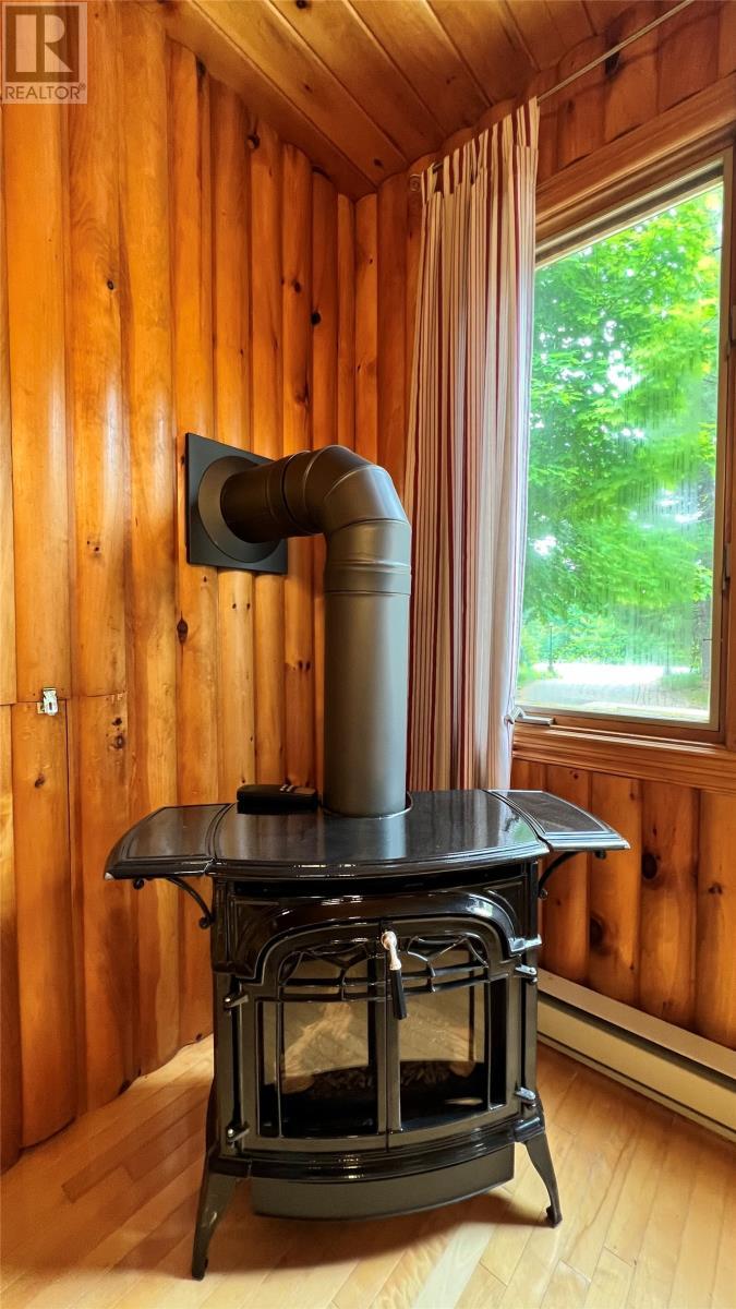 Vermont Oil stove - 31 Terra Nova Road, Terra Nova, NL - Indoor Photo Showing Other Room
