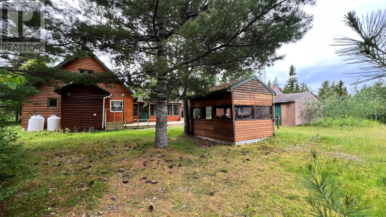 Covered screened outside dining area. - 31 Terra Nova Road, Terra Nova, NL - Outdoor