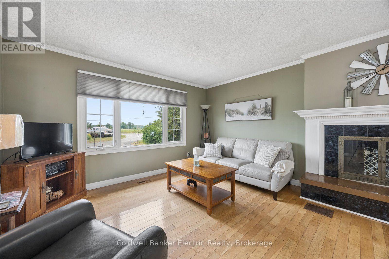 1657 4Th Line, Douro-Dummer, ON - Indoor Photo Showing Living Room With Fireplace