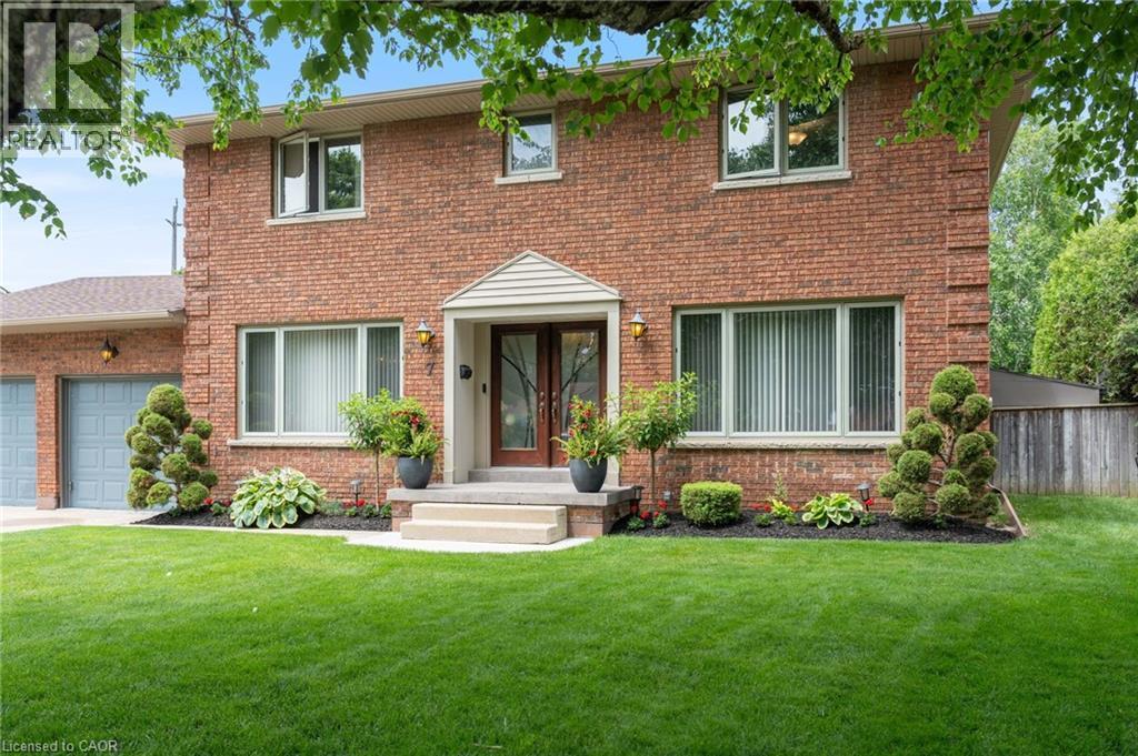 Brick exterior with a peaked portico over the double-door entry - 7 Thomson Road, Simcoe, ON - Outdoor