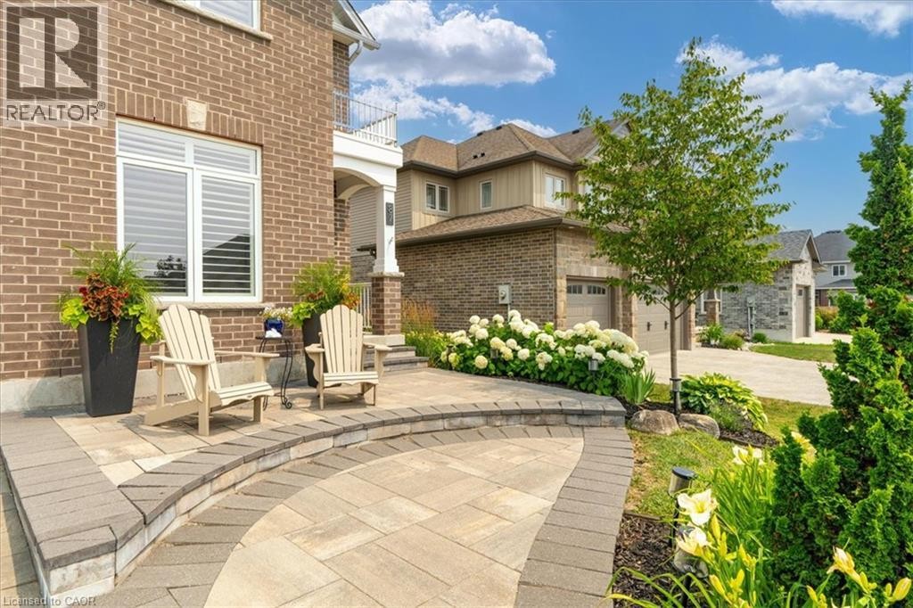 Brick facade featuring white trim windows with louvered shutters - 87 Boyd Boulevard, Thamesford, ON - Outdoor