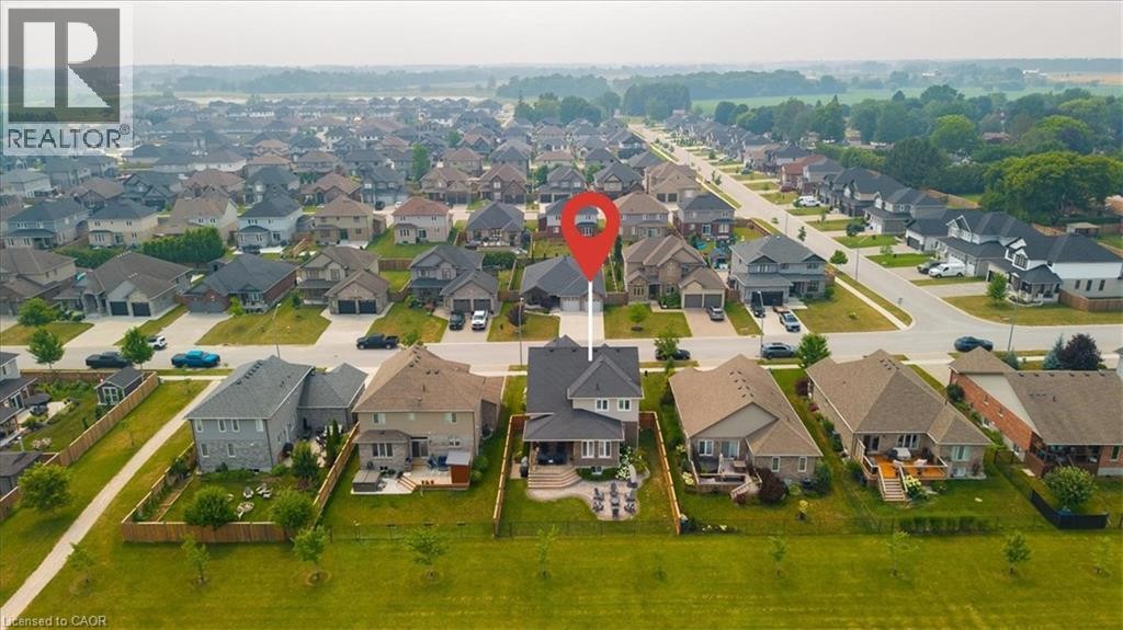 Aerial perspective showcasing a residential development with multiple single-family homes - 87 Boyd Boulevard, Thamesford, ON - Outdoor With View