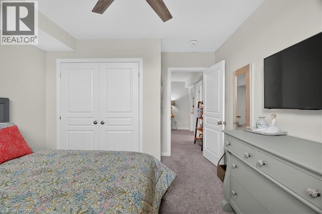 Neutral wall paint with crown molding and recessed lighting - 87 Boyd Boulevard, Thamesford, ON - Indoor Photo Showing Bedroom