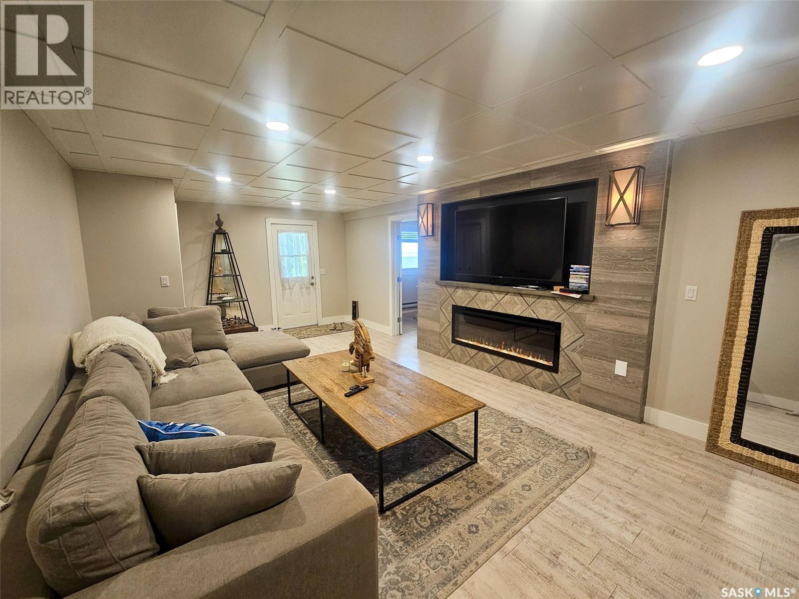 59 Snedden Crescent, Maple Bush Rm No. 224, SK - Indoor Photo Showing Living Room With Fireplace