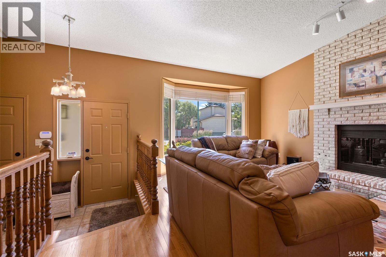 3147 Harding Street, Regina, SK - Indoor Photo Showing Living Room With Fireplace