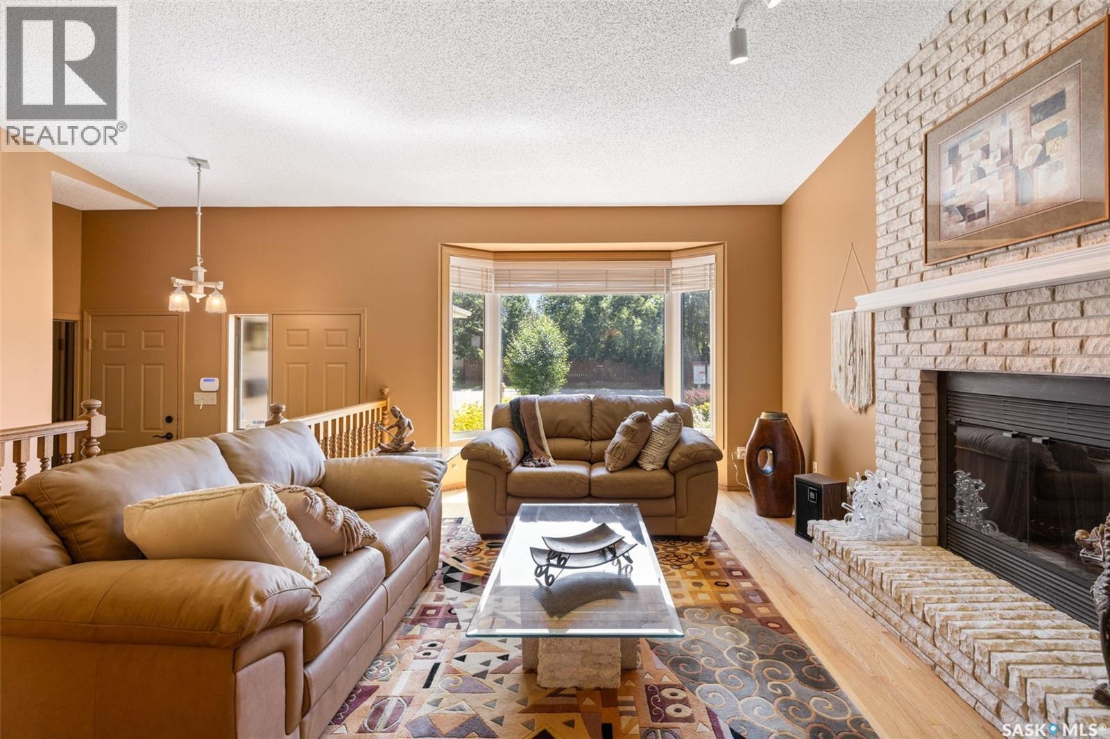 3147 Harding Street, Regina, SK - Indoor Photo Showing Living Room With Fireplace