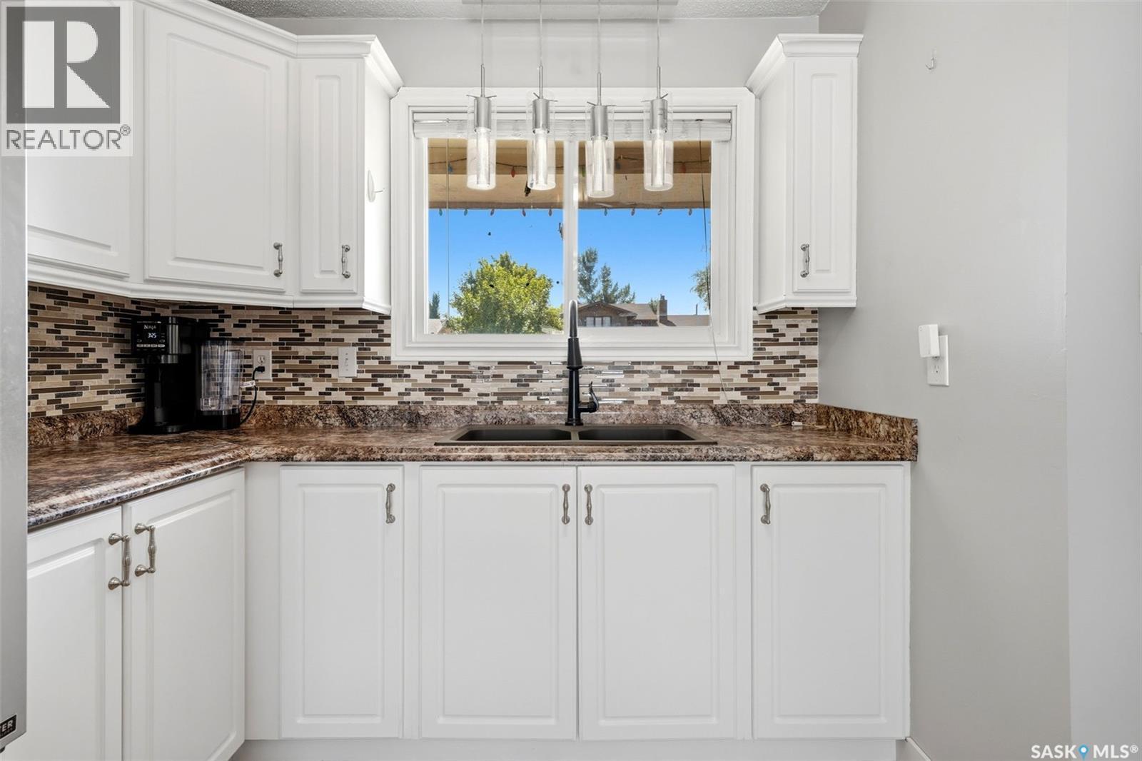 614 3Rd Avenue, Pilot Butte, SK - Indoor Photo Showing Kitchen With Double Sink