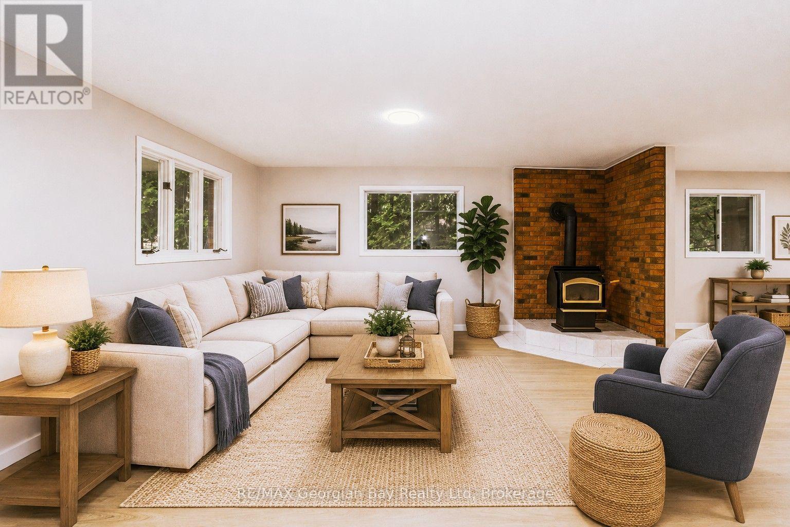 Main Level Family - Virtually Furnished - 25 Albert Avenue, Tiny, ON - Indoor Photo Showing Living Room With Fireplace