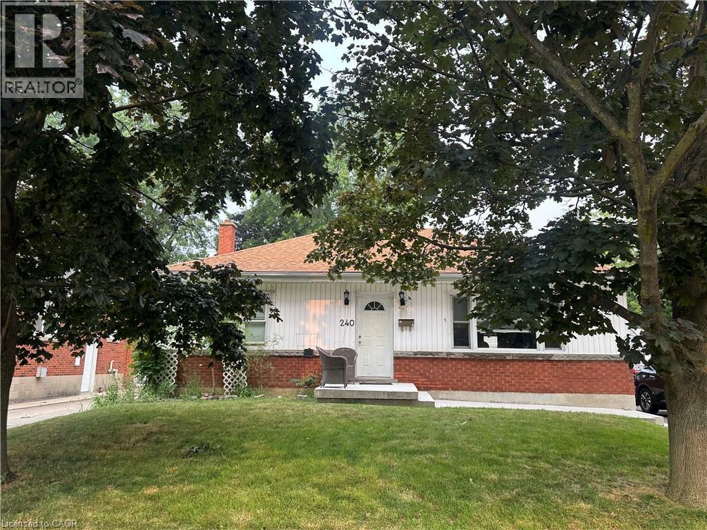 Ranch-style residence featuring a brick foundation and white vertical siding - 240 West 2Nd Street, Hamilton, ON - Outdoor