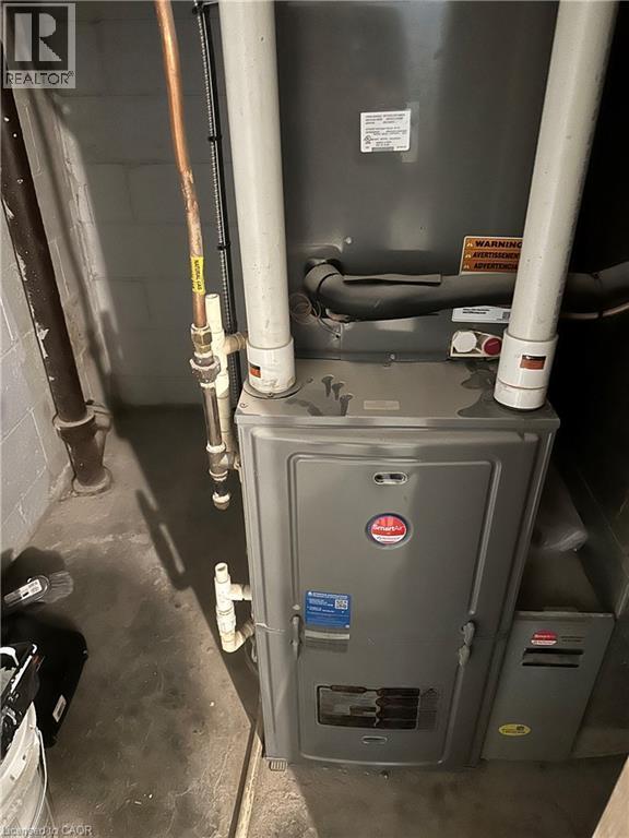 Furnace unit with associated PVC and copper piping - 240 West 2Nd Street, Hamilton, ON - Indoor Photo Showing Basement