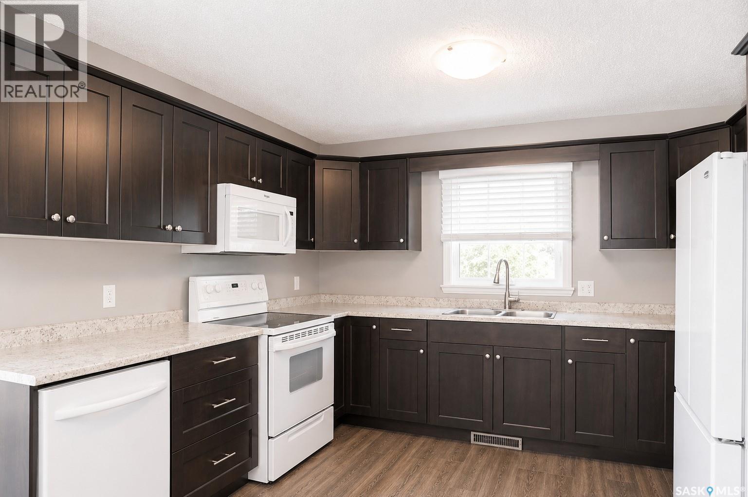 326 3Rd Avenue, Young, SK - Indoor Photo Showing Kitchen With Double Sink