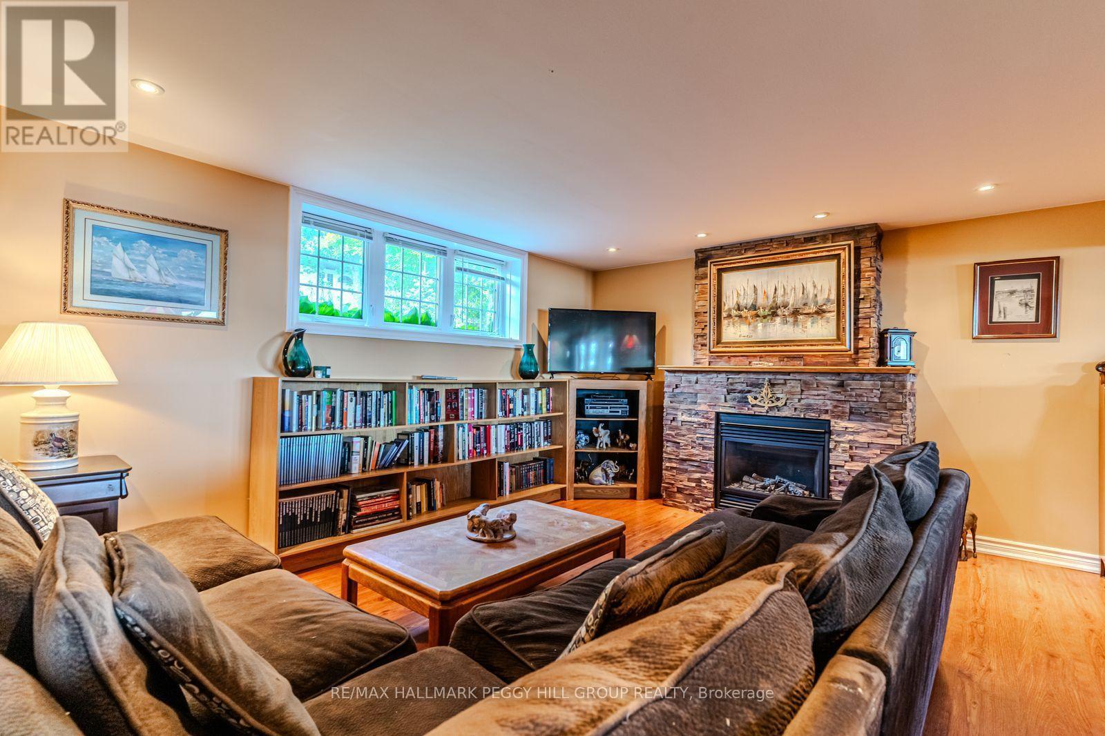 383 Peek-A-Boo Trail, Tiny, ON - Indoor Photo Showing Other Room With Fireplace
