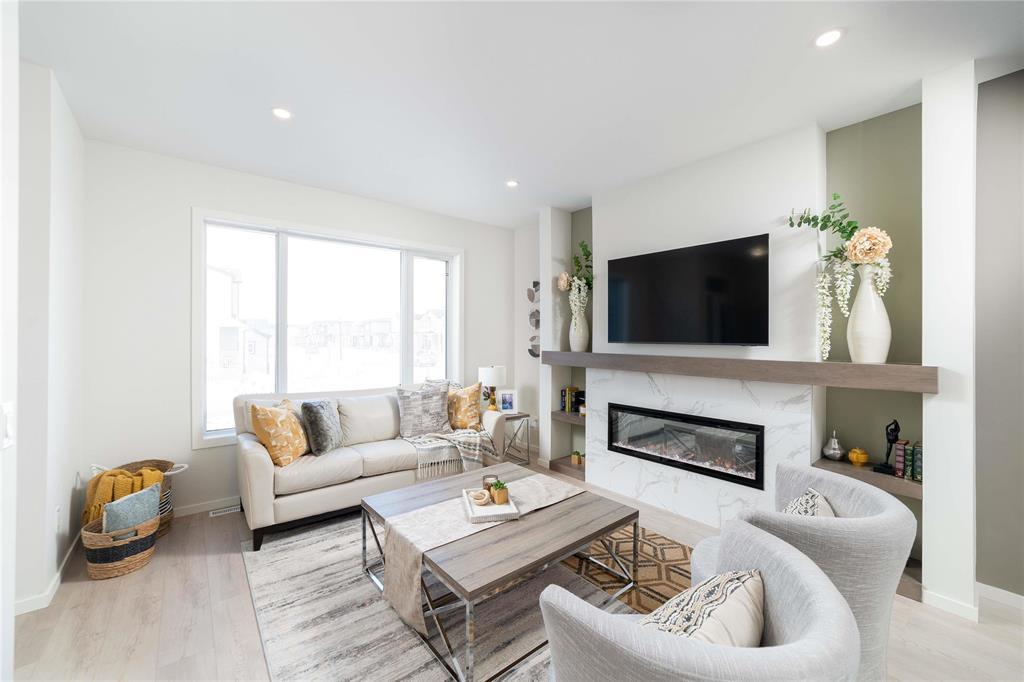 77 Ken Oblik Drive, Winnipeg, MB - Indoor Photo Showing Living Room With Fireplace