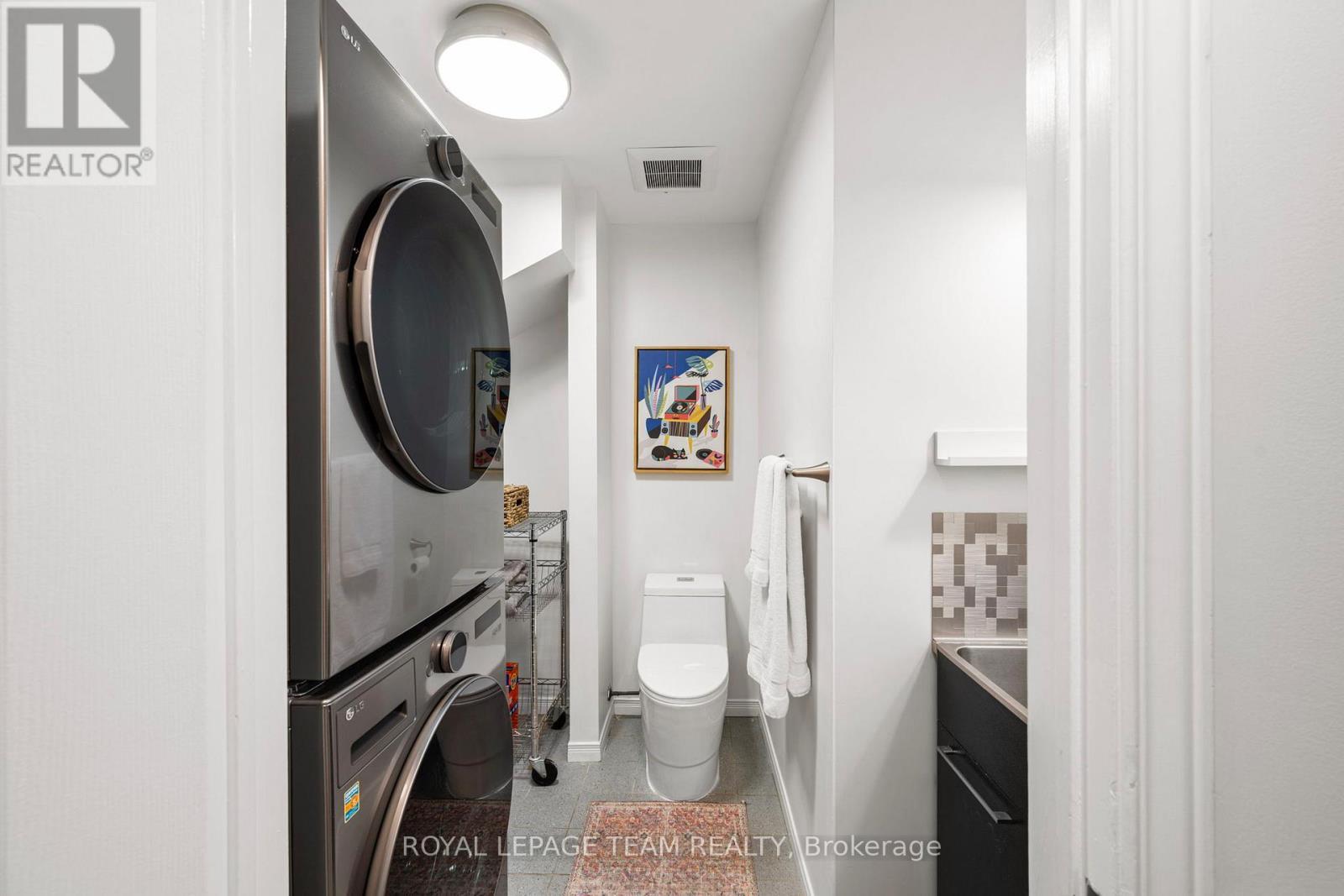 Main floor laundry/powder with LG washer & dryer - 212 Provender Avenue, Ottawa, ON - Indoor Photo Showing Laundry Room