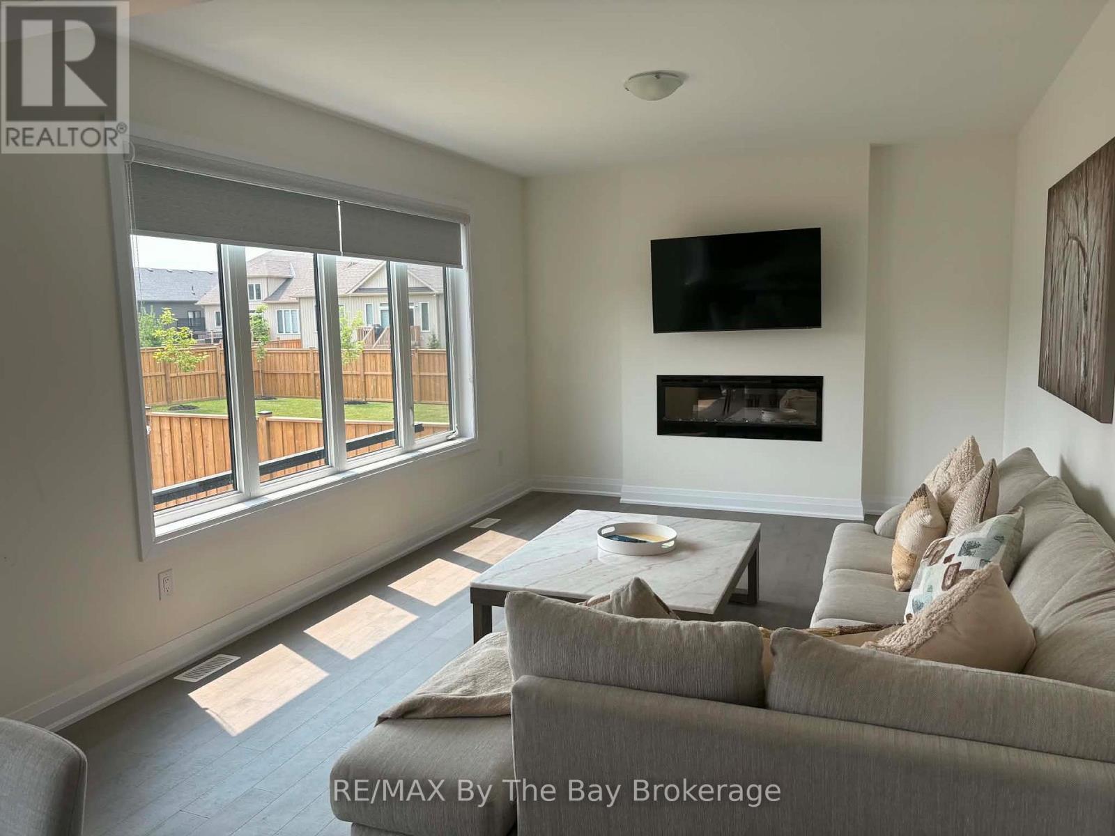 Upper Unit - 218 Mapleside Drive, Wasaga Beach, ON - Indoor Photo Showing Living Room With Fireplace