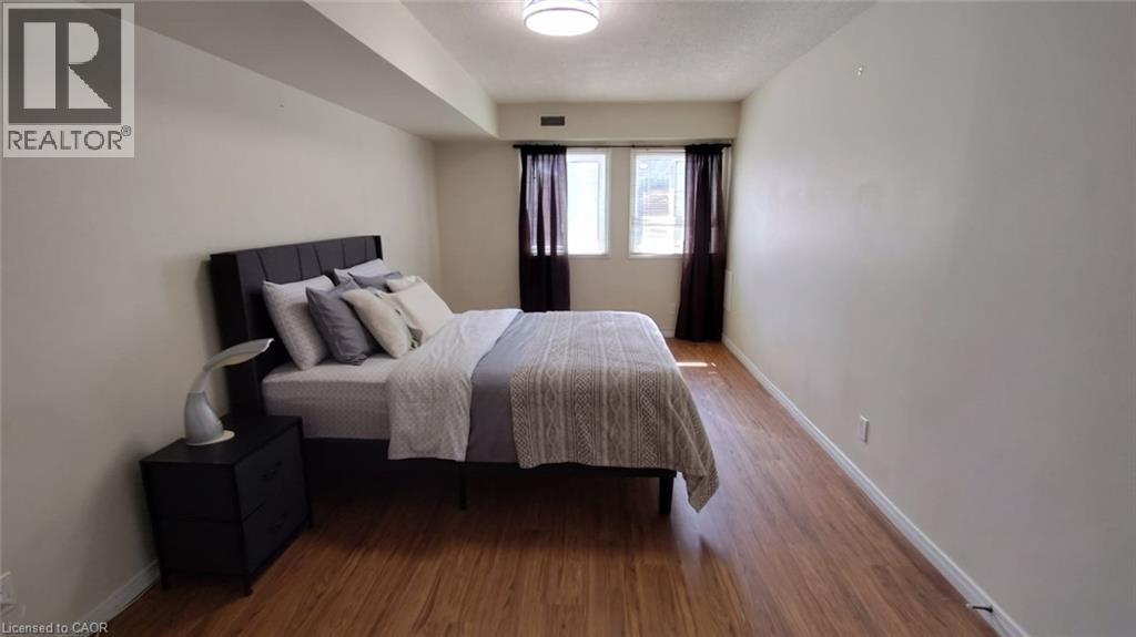 New light fixture in the bedroom 2026 - 500 Westmount Road W Unit# 103, Kitchener, ON - Indoor Photo Showing Bedroom