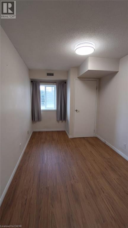 New light fixture 2026 - 500 Westmount Road W Unit# 103, Kitchener, ON - Indoor Photo Showing Other Room