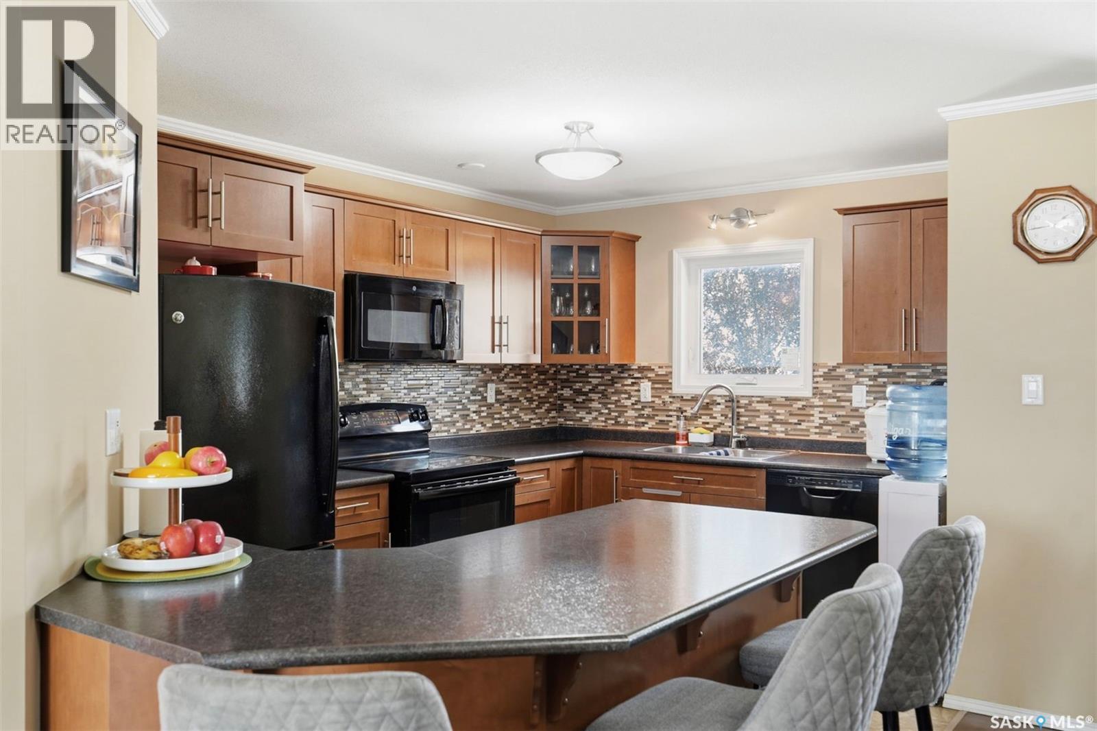 406 225 Hassard Close, Saskatoon, SK - Indoor Photo Showing Kitchen With Double Sink