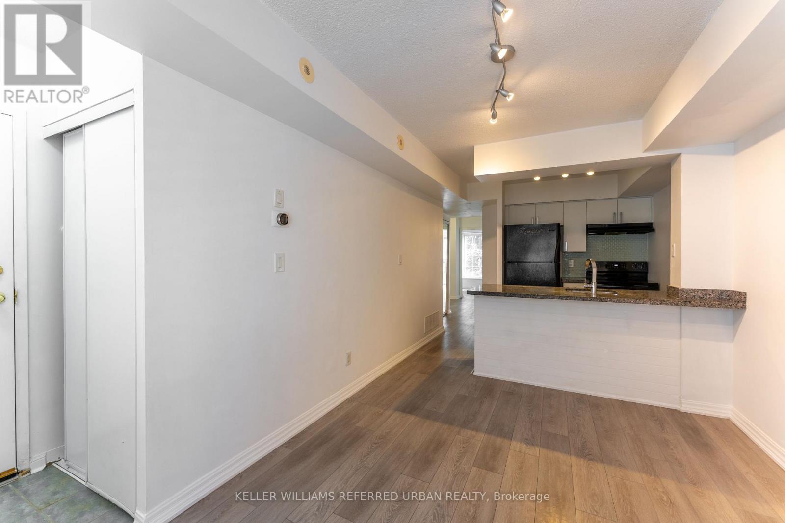 Living Room and Kitchen Island - 651 - 3 Everson Drive, Toronto, ON - Indoor