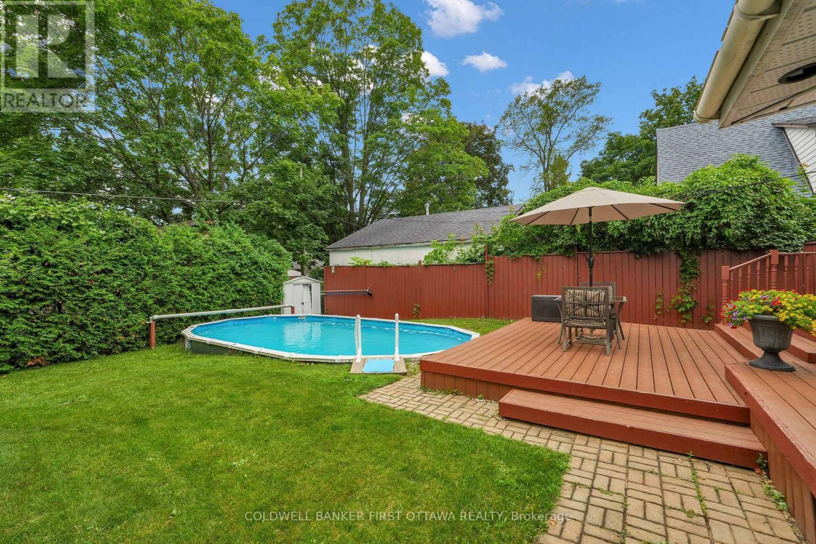 Private oasis! - 636 Malartic Avenue, Ottawa, ON - Outdoor With Above Ground Pool With Deck Patio Veranda With Backyard