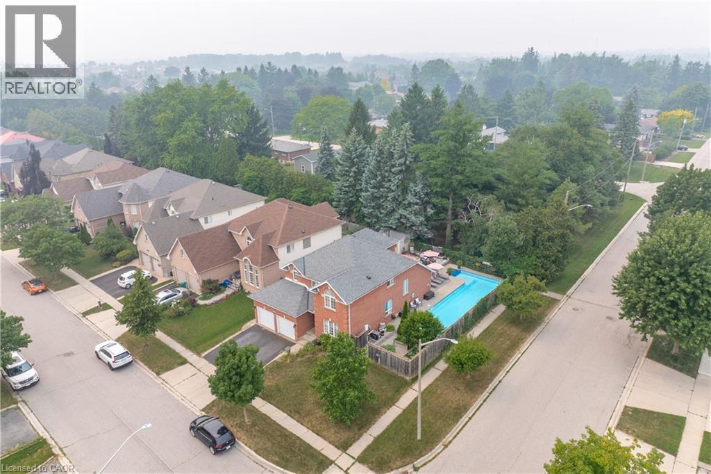 Brick two-story residence featuring a gray shingled roof and an attached two-car garage - 79 Beaverbrook Crescent, Cambridge, ON - Outdoor With View