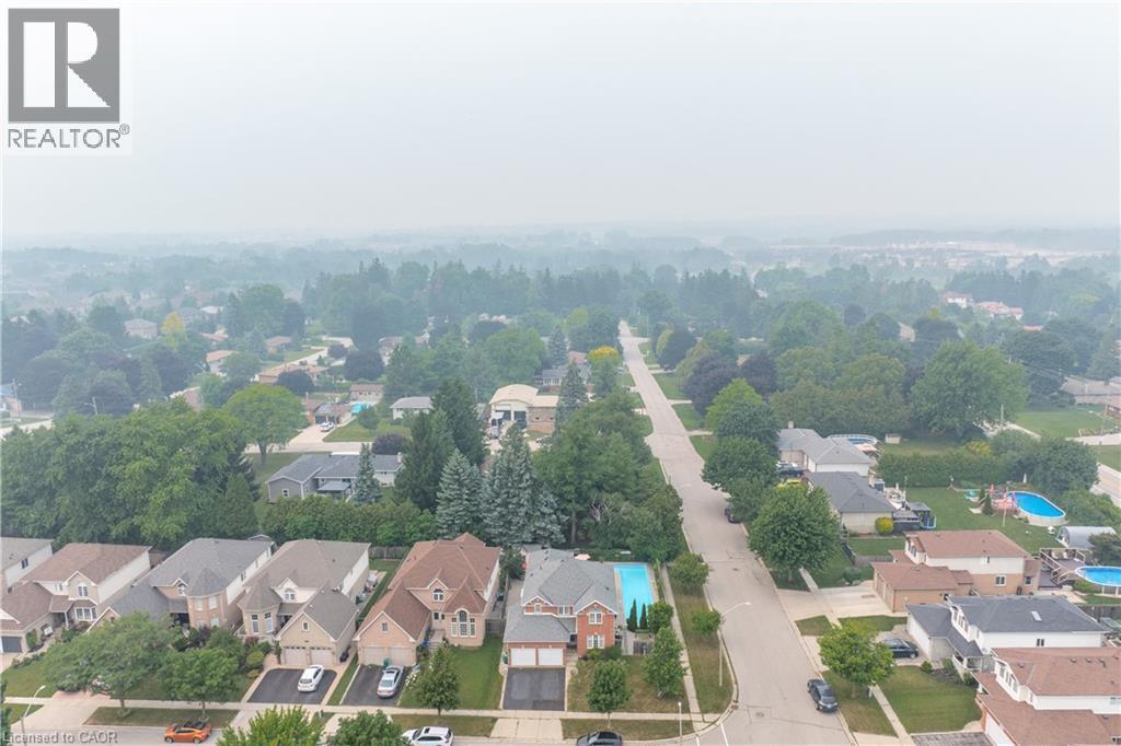 Aerial overview of a residential neighborhood with mature tree canopies - 79 Beaverbrook Crescent, Cambridge, ON - With View