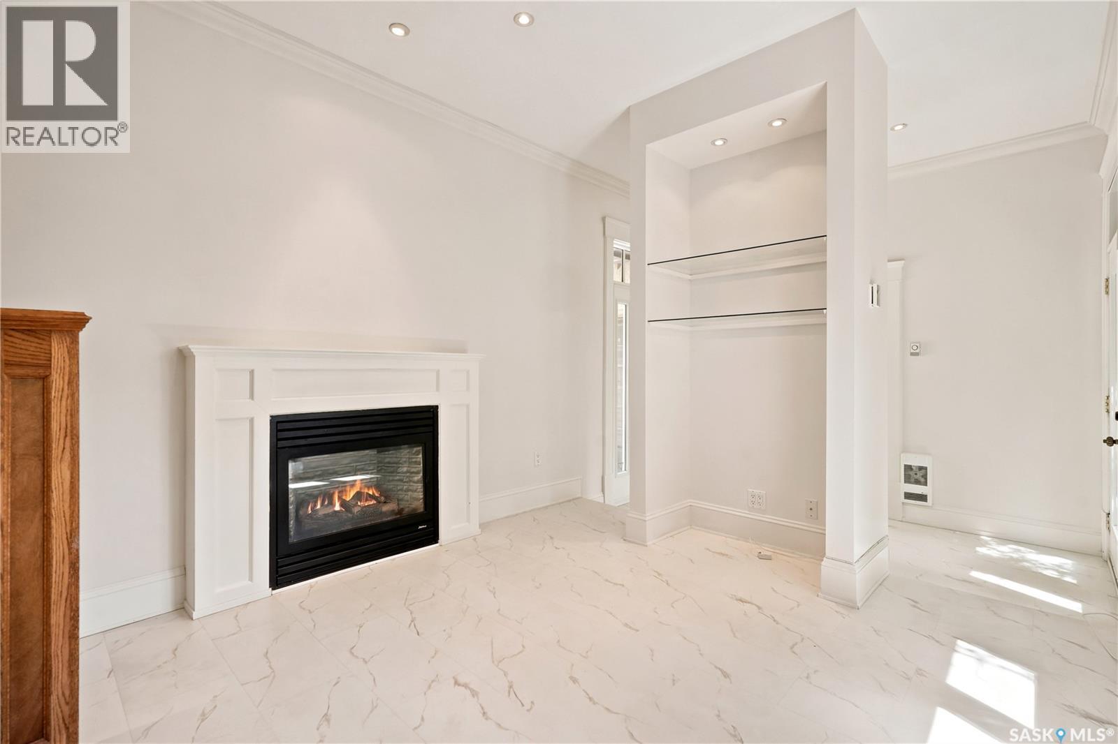 3151 Angus Street, Regina, SK - Indoor Photo Showing Living Room With Fireplace