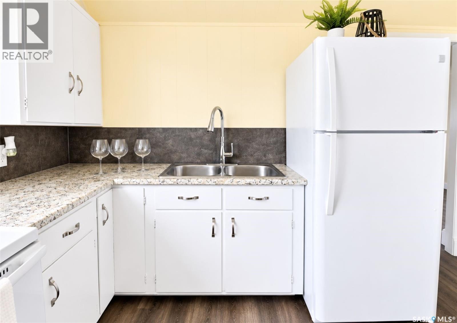 108 Third Avenue S, Pierceland, SK - Indoor Photo Showing Kitchen With Double Sink