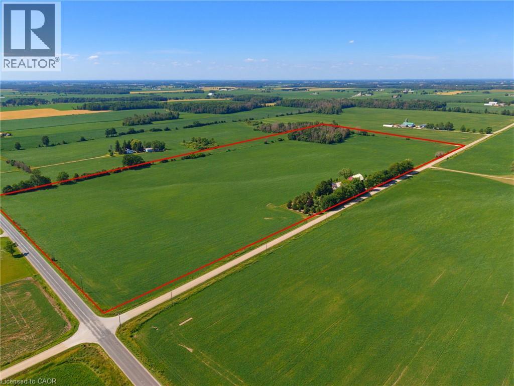Expansive agricultural land featuring verdant fields and a clear boundary line - 8430 Road 146, Listowel, ON - Outdoor With View
