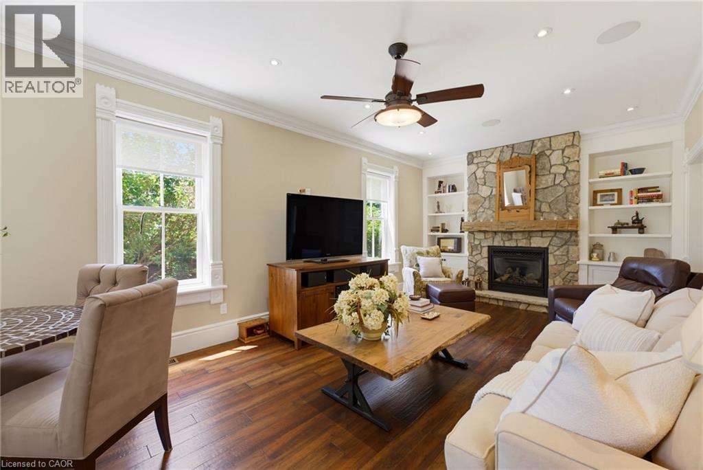 Living area featuring hardwood flooring - 8430 Road 146, Listowel, ON - Indoor Photo Showing Living Room With Fireplace