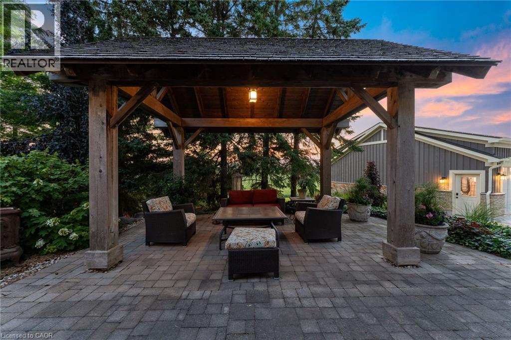 Spacious outdoor gazebo with exposed timber framing and shingled roof - 8430 Road 146, Listowel, ON - Outdoor