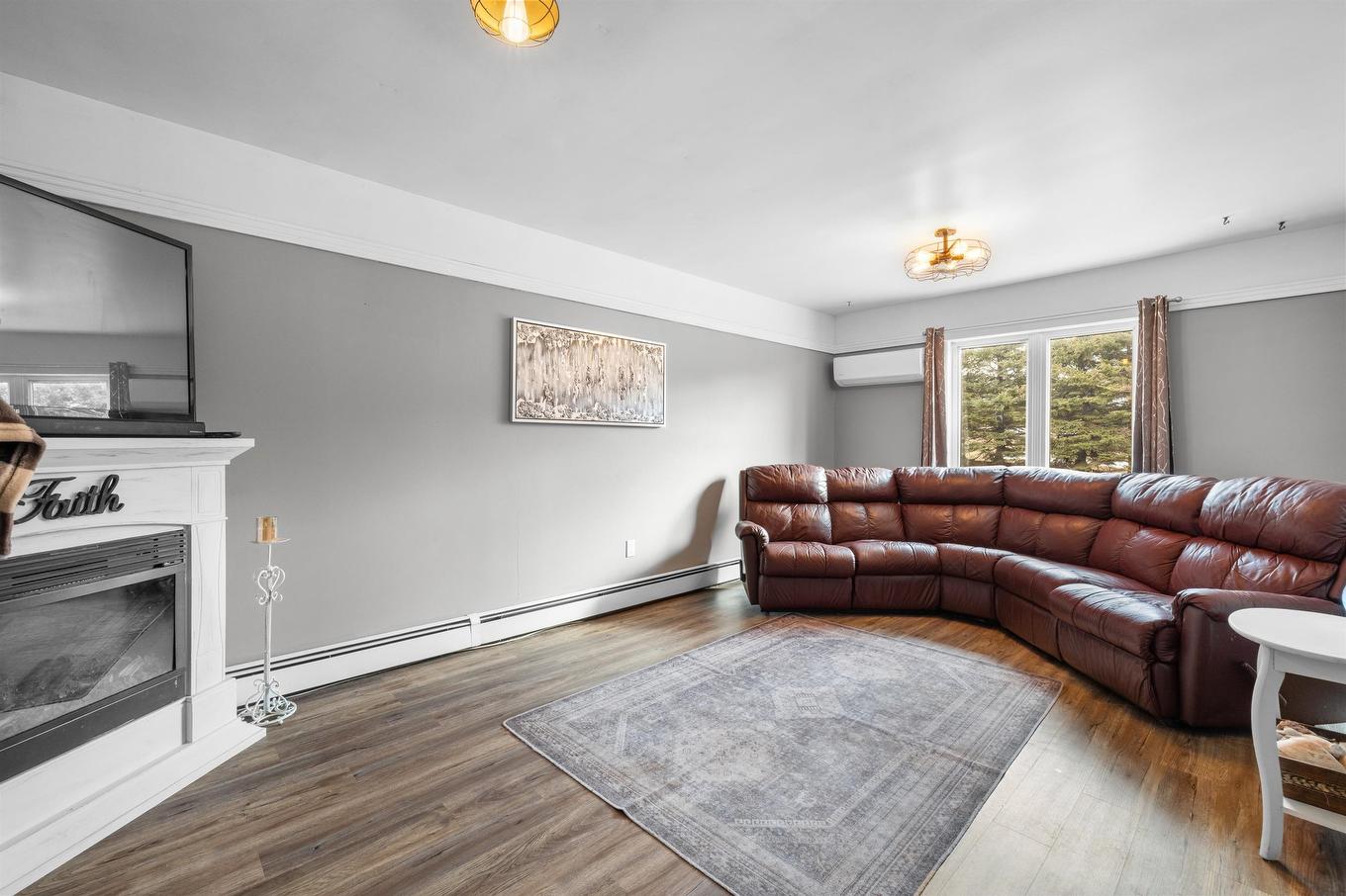 37 Franks Lane, Souris West, PE - Indoor Photo Showing Living Room With Fireplace