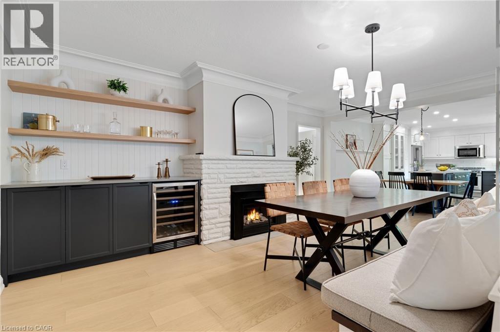 203 Forsyth Drive, Waterloo, ON - Indoor Photo Showing Dining Room With Fireplace