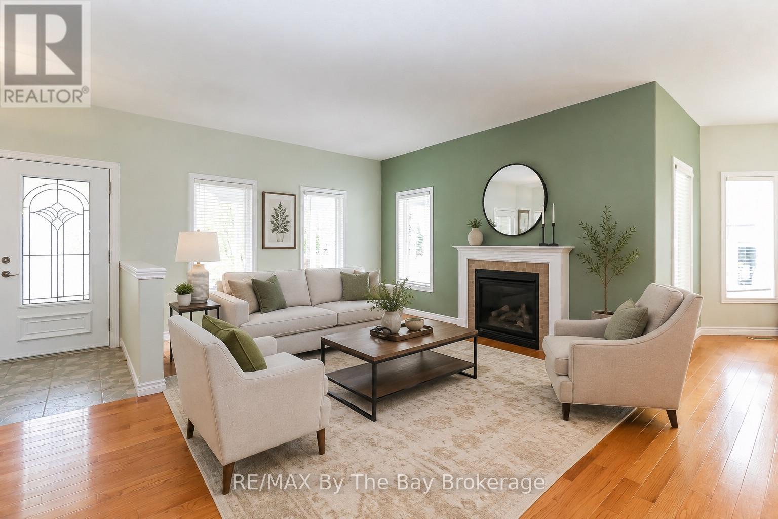 virtually staged - 60 Martyn Drive, Wasaga Beach, ON - Indoor Photo Showing Living Room With Fireplace