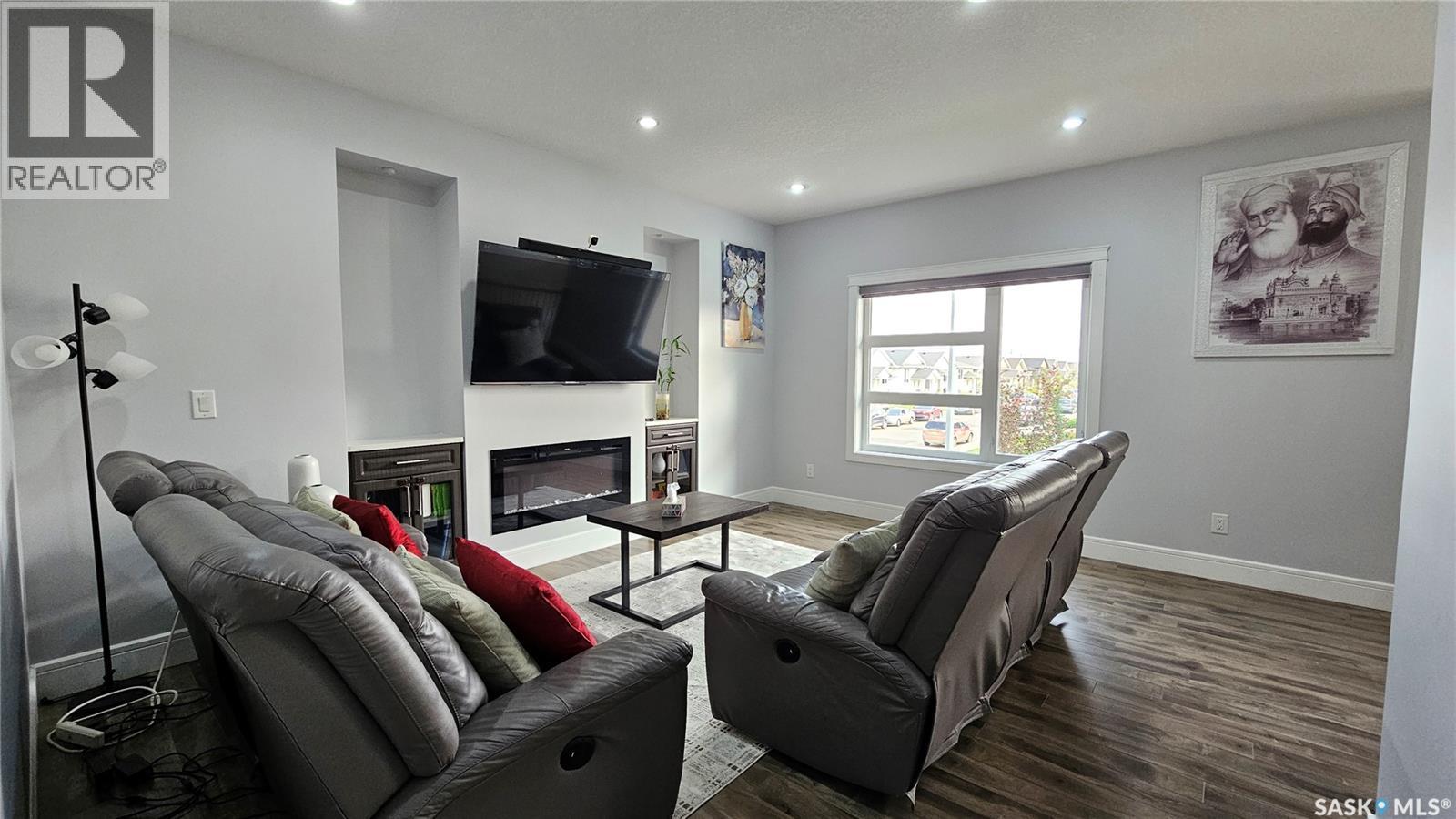 126 Bolstad Way, Saskatoon, SK - Indoor Photo Showing Living Room With Fireplace