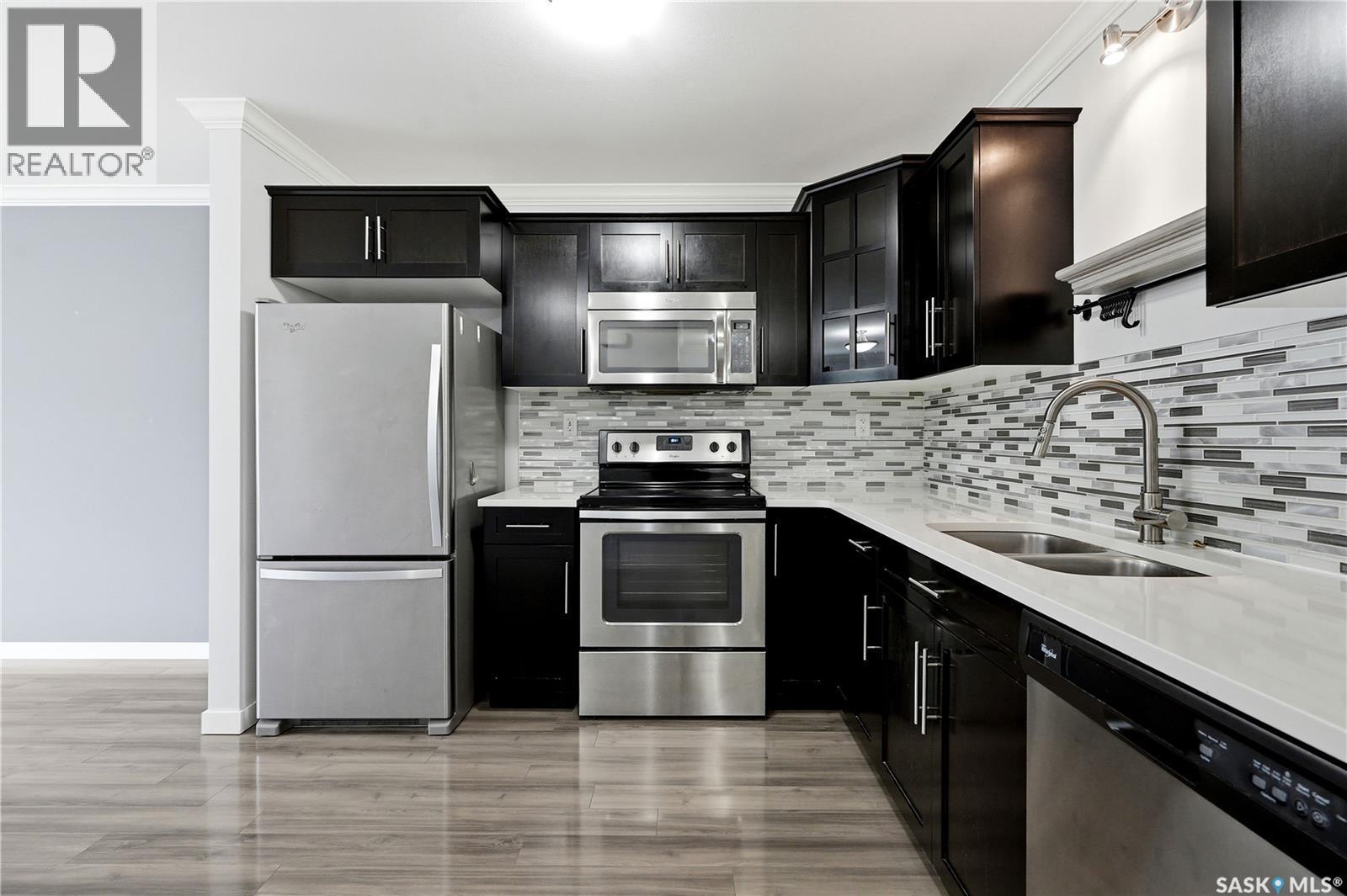 321 620 Cornish Road, Saskatoon, SK - Indoor Photo Showing Kitchen With Stainless Steel Kitchen With Double Sink With Upgraded Kitchen