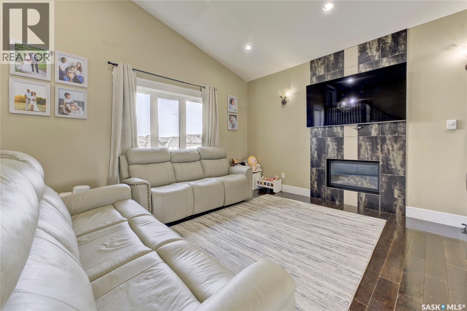 619 Maple Crescent, Warman, SK - Indoor Photo Showing Living Room With Fireplace