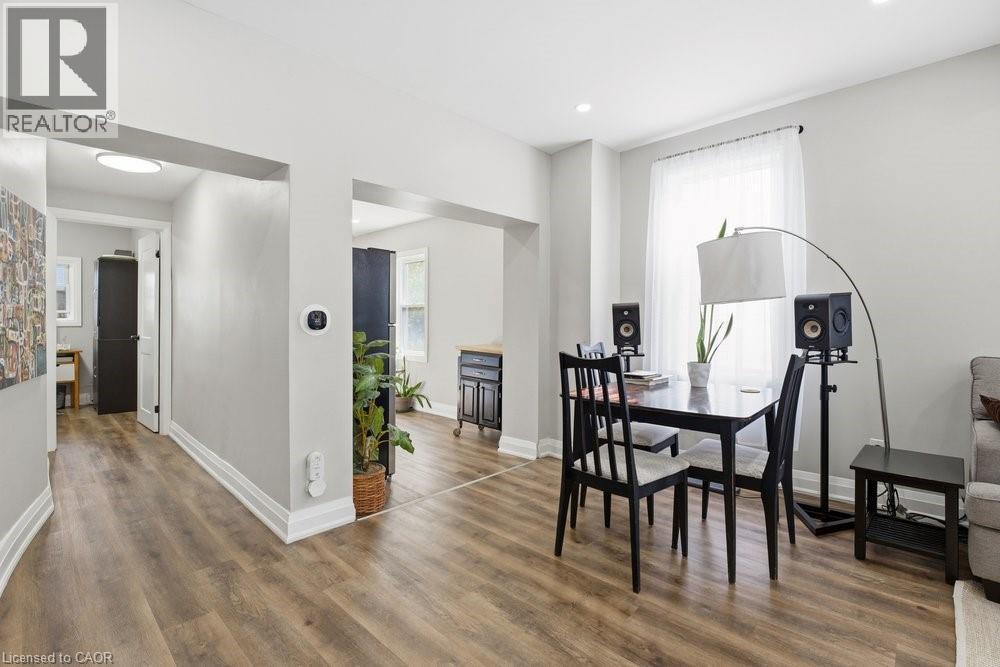 Bright interior featuring wood-finish flooring throughout, recessed lighting, and white baseboards - 773 Lawrence Road, Hamilton, ON - Indoor Photo Showing Other Room