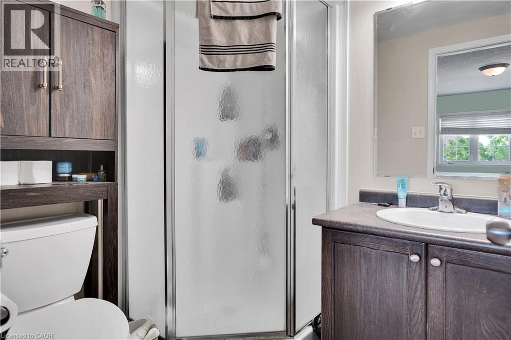 Shower enclosure with textured glass paneling and chrome framing - 60 Featherstone Street, Kitchener, ON - Indoor Photo Showing Bathroom