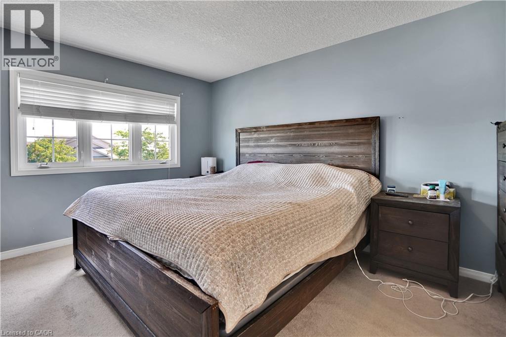 Expansive window with white trim and privacy blinds - 60 Featherstone Street, Kitchener, ON - Indoor Photo Showing Bedroom