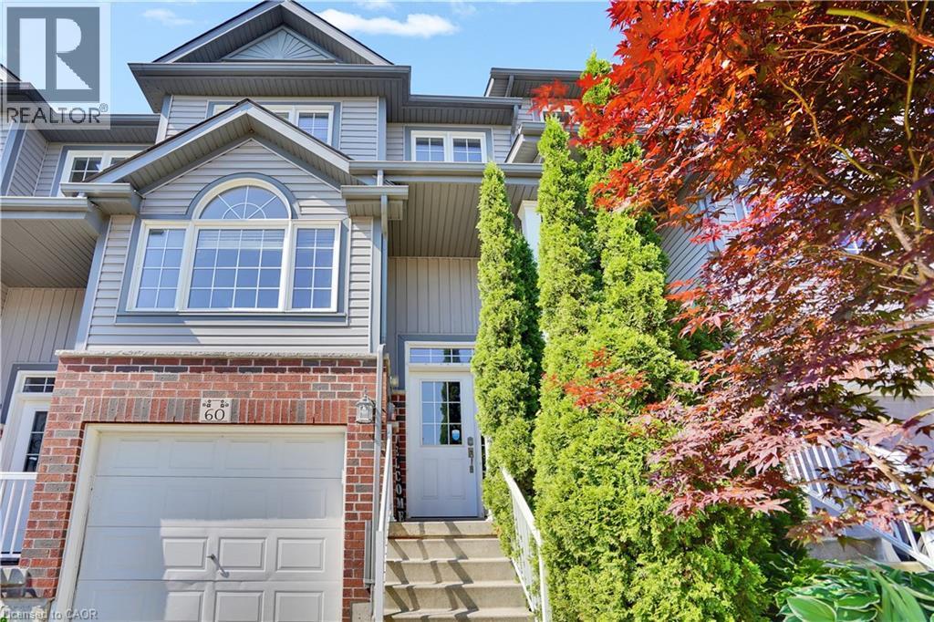 Multi-level townhome exterior featuring brick and siding facade - 60 Featherstone Street, Kitchener, ON - Outdoor